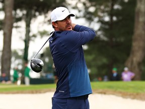 Brooks Koepka plays his shot from the third tee during a practice round prior to the 2024 Masters Tournament.