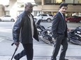 Former BC Lions and CFL players Arland Bruce (left) and Larry Thompson outside BC Supreme Court in 2016.