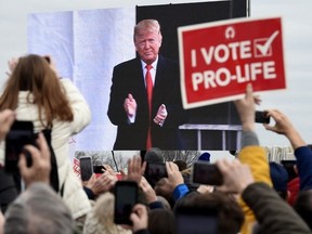 Pro-life demonstrators listen to US President Donald Trump as he speaks at the 47th annual "March for Life" in Washington, DC, on January 24, 2020. Abortion rights should be left up to US states to decide, Republican presidential candidate Donald Trump said on April 8, 2024, effectively rejecting a national abortion ban after months of mixed signals on one of the November election's most contentious issues.