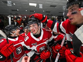 The 67’s congratulate Sam Mayer during a game against the Brantford Bulldogs at the Arena at TD Place on Thursday.  Tim Austen/Ottawa 67’s