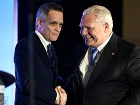 Ontario Premier Doug Ford shakes hands with Ottawa Mayor Mark Sutcliffe