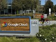 A person rides past the Google sign outside the Google offices in Sunnyvale, Calif., on Thursday, April 18, 2024.
