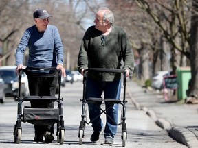 Columnist Bruce Deachman, 60, right, recently underwent a double hip replacement and, while out with his walker this past winter, he met Joe Falsatti, with a similar walker. Despite both men living on the same street for decades each, they'd never met until Joe, 89, challenged Deachman to a race.
