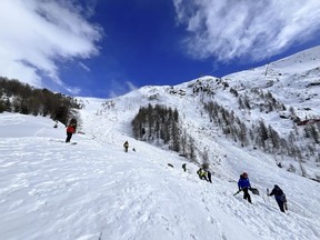 An Ontario county says a local paramedic is dead in an avalanche while she was snowboarding during a vacation in Switzerland. In this handout photo provided by Kantonspolizei Wallis, Rescuers work on a site of an avalanche fell on the Riffelberg, Switzerland, Tuesday, April 2, 2024. THE CANADIAN PRESS/AP-Keystone, HO-KANTONSPOLIZEI WALLIS, *MANDATORY CREDIT*