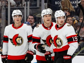 Jakob Chychrun #6 of the Ottawa Senators celebrates his goal with teammates Shane Pinto #57 and Drake Batherson #19 against the Boston Bruins during the second period at the TD Garden on April 16, 2024 in Boston, Massachusetts.