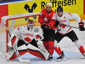 Switzerland’s Nino Niederreiter vies for the puck with Canada's Colton Parayko in Prague, Czech Republic on May 19, 2024.