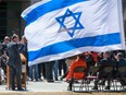 A 2014 file photo of a ceremony at Ottawa City Hall to mark that year's raising of the flag of Israel in Canada's capital city.