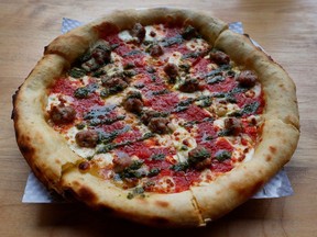 The Lisgar pizza at Pizza Nerds in Centretown features house-made sausage, local cheese, basil puree and tomato sauce.