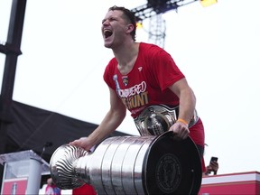 Matthew Tkachuk of the Florida Panthers hoists the Stanley Cup during a celebration for the Florida Panthers' win of the Stanley Cup on Sunday, June 30, 2024, in Fort Lauderdale, Fla.