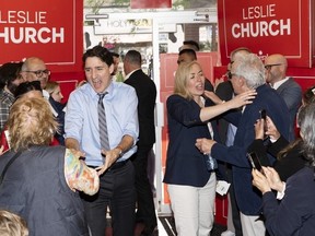 Liberal Leader Justin Trudeau, left, and Liberal candidate for Toronto-St. Paul's Leslie Church, right, greet supporters at a campaign volunteer event, in Toronto on Thursday, May 30, 2024.