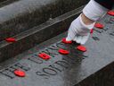 A poppy is laid at the Tomb of the Unknown Soldier after a Remembrance Day ceremony at the National War Memorial in Ottawa on November 11, 2025.