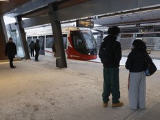 People wait for the LRT at Hurdman Station in Ottawa.