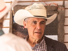 Prime Minister Mark Carney speaks with vendors and exhibitors during a visit to the Calgary Stampede on Sunday, July 12, 2026.