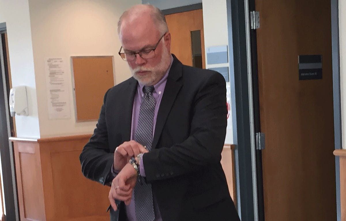 Former Bridgewater police chief John Collyer waits to enter court on charges of sexual assault and sexual exploitation at the Bridgewater courthouse on Thursday, Oct. 24, 2019. He was found guilty of both charges.