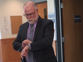 Former Bridgewater police chief John Collyer waits to enter court on charges of sexual assault and sexual exploitation at the Bridgewater courthouse on Thursday, Oct. 24, 2019. He was found guilty of both charges.