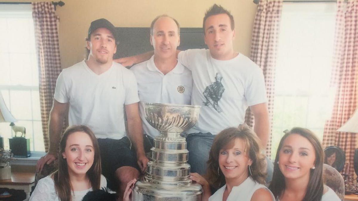 Boston Bruins winger Brad Marchand, top right, celebrates this day with the Stanley Cup in 2011. - NHL