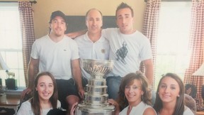 Boston Bruins winger Brad Marchand, top right, celebrates this day with the Stanley Cup in 2011. - NHL