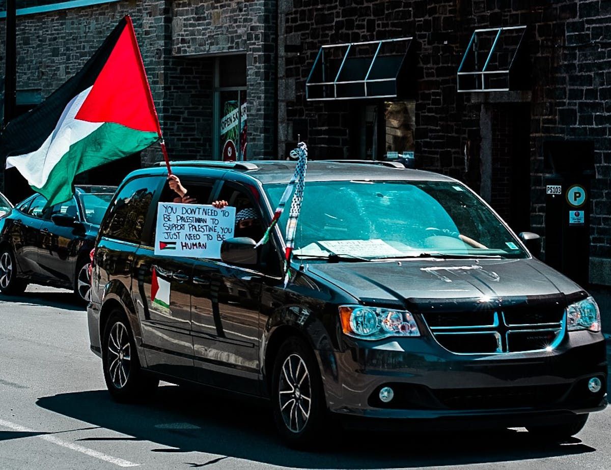 Protesters held signs and the Palestinian flag during the #FreePalestine rally that was held in Halifax on Saturday. Photo Credit: Mohammed Al-Karmanji