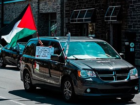 Protesters held signs and the Palestinian flag during the #FreePalestine rally that was held in Halifax on Saturday. Photo Credit: Mohammed Al-Karmanji