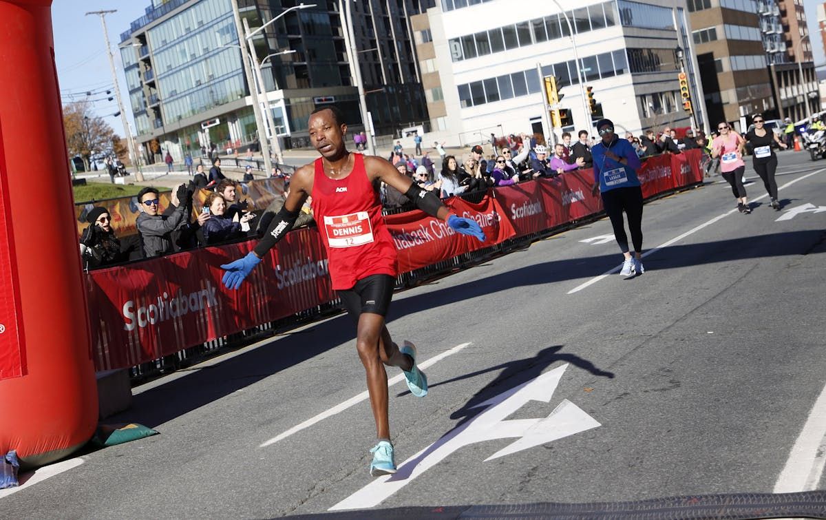 Dennis Mbelenzi crosses the finish line to win the Blue Nose Marathon in Halifax in November 2021.