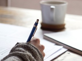 A woman writes a letter. Letters to the editor are welcome at letters@theguardian.pe.ca.