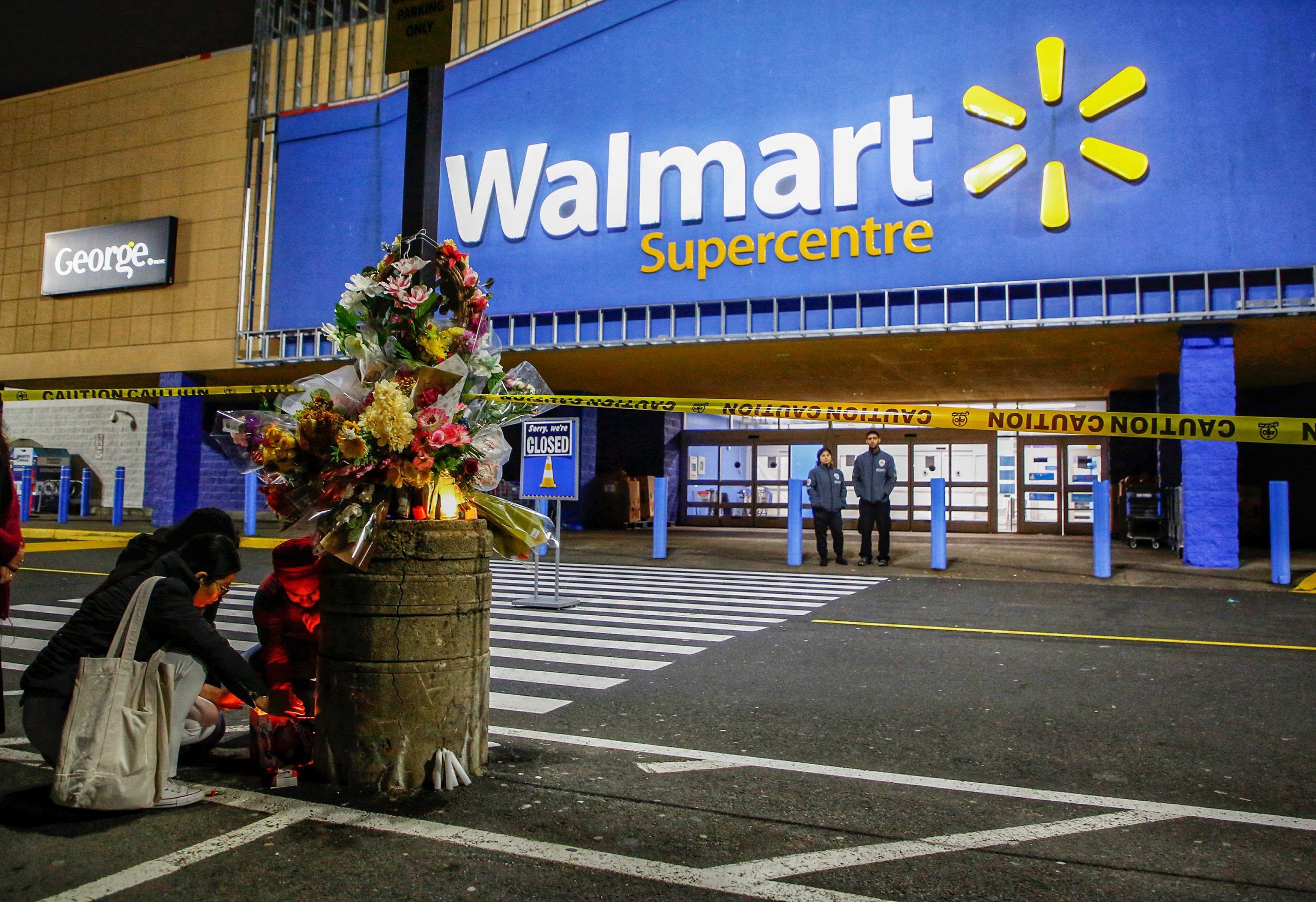  Friends and co-workers of a 19-year-old woman who died suddenly at a Mumford Walmart, gather to light candles and place flowers outside the store in Halifax on Oct. 23, 2024. The worker was found dead in a bakery oven.