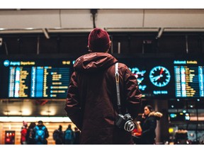 looking at flight board in airport