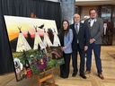 Brittany Wiseman, left, Minister Scott Reid, who is responsible for Indigenous affairs and reconcilitation, and Chief Brad Benoit at the unveiling of Wiseman's painting,