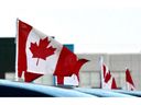 Canadian flags fly at an Atlantic Canadian business.