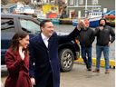 Conservative leader Pierre Poilievre arrives at a campaign stop in Petty Harbour, Newfoundland and Labrador, Tuesday afternoon. At left is his wife Anaida.