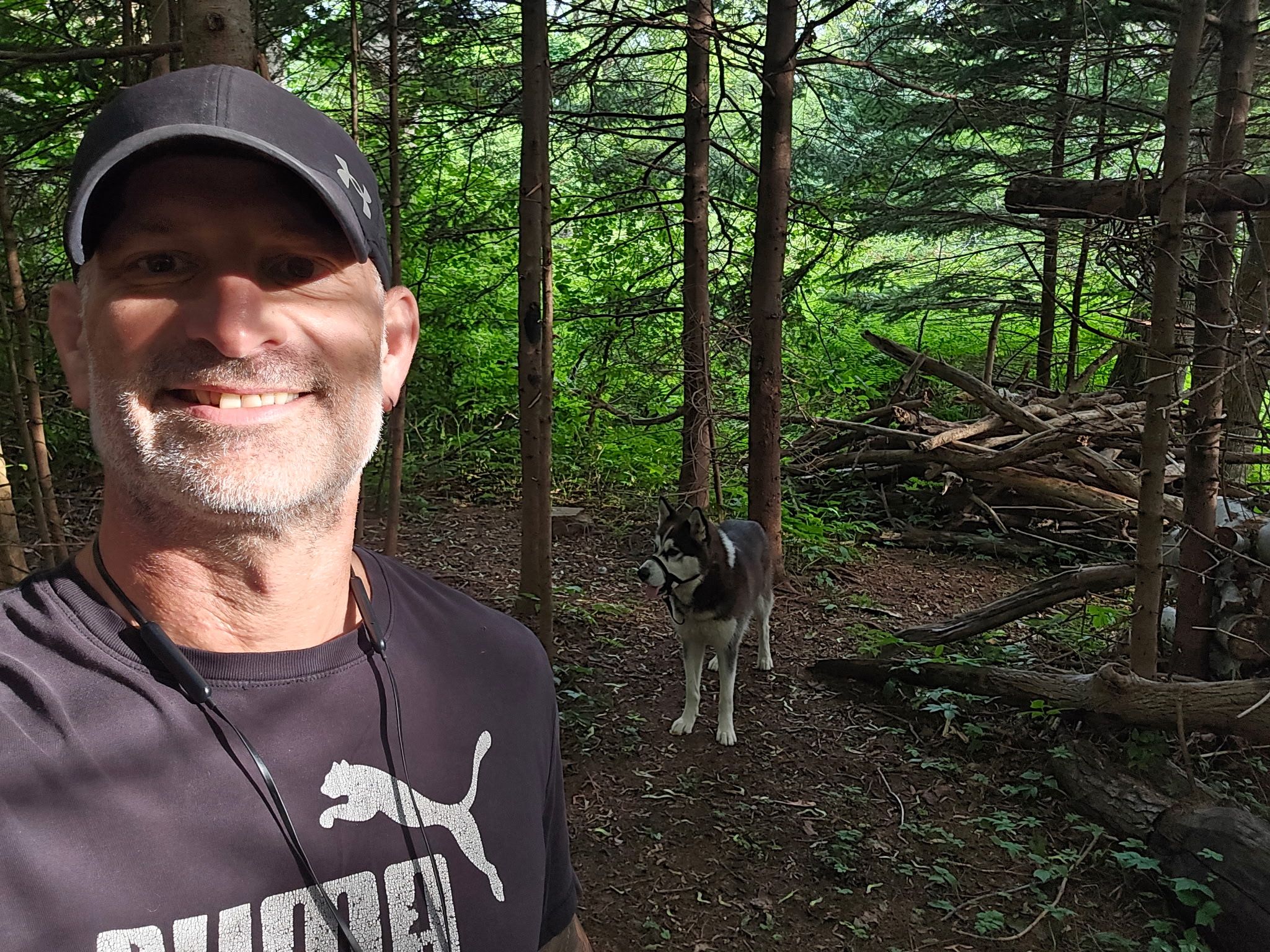  afghan war veteran jeffrey evely is pictured in the woods with his dog axl.