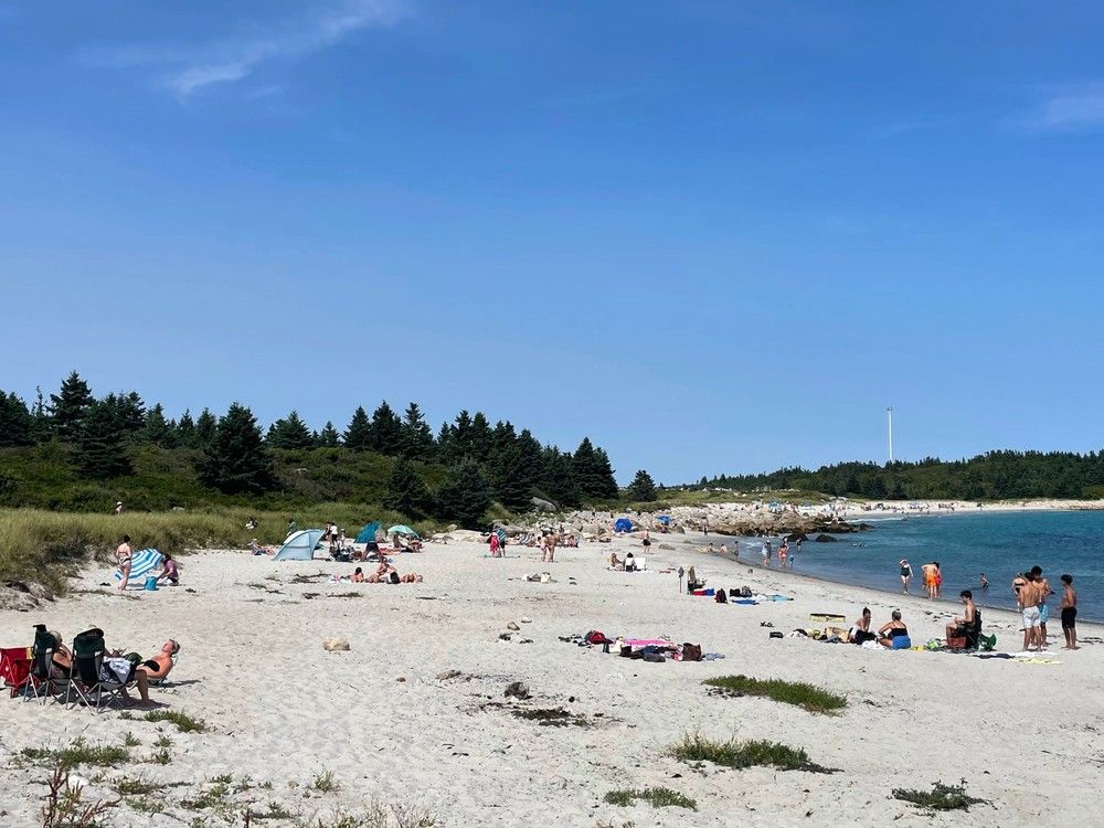  People enjoy Crystal Crescent Beach on Thursday.