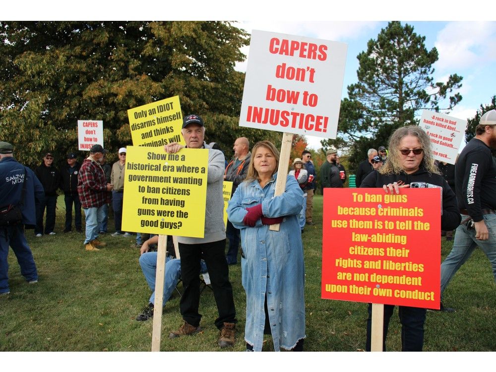 From left David Morrison of Leitches Creek, Margaret Poirier Stevens of Inverness and Bernadette Poirier of Inverness stand facing the traffic along Grand Lake Road with other protestors gathered outside Cape Breton Regional Police headquarters in Sydney to rally against the federal gun buy back program on Oct. 2. NICOLE SULLIVAN / CAPE BRETON POST From left David Morrison of Leitches Creek, Margaret Poirier Stevens of Inverness and Bernadette Poirier of Inverness stand facing the traffic along Grand Lake Road with other protestors gathered outside Cape Breton Regional Police headquarters in Sydney to rally against the federal gun buy back program on Oct. 2. NICOLE SULLIVAN / CAPE BRETON POST