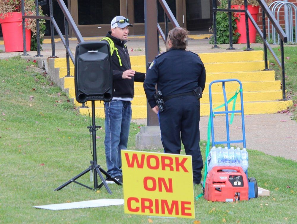 Jeff McNeil, left, president of the Port Morien Wildlife Association and co-organizer of Thursday’s rally, speaks with a regional police officer just before the start of the rally outside of Myles F. Burke Police Headquarters in Sydney. Jeff McNeil, left, president of the Port Morien Wildlife Association and co-organizer of Thursday’s rally, speaks with a regional police officer just before the start of the rally outside of Myles F. Burke Police Headquarters in Sydney.