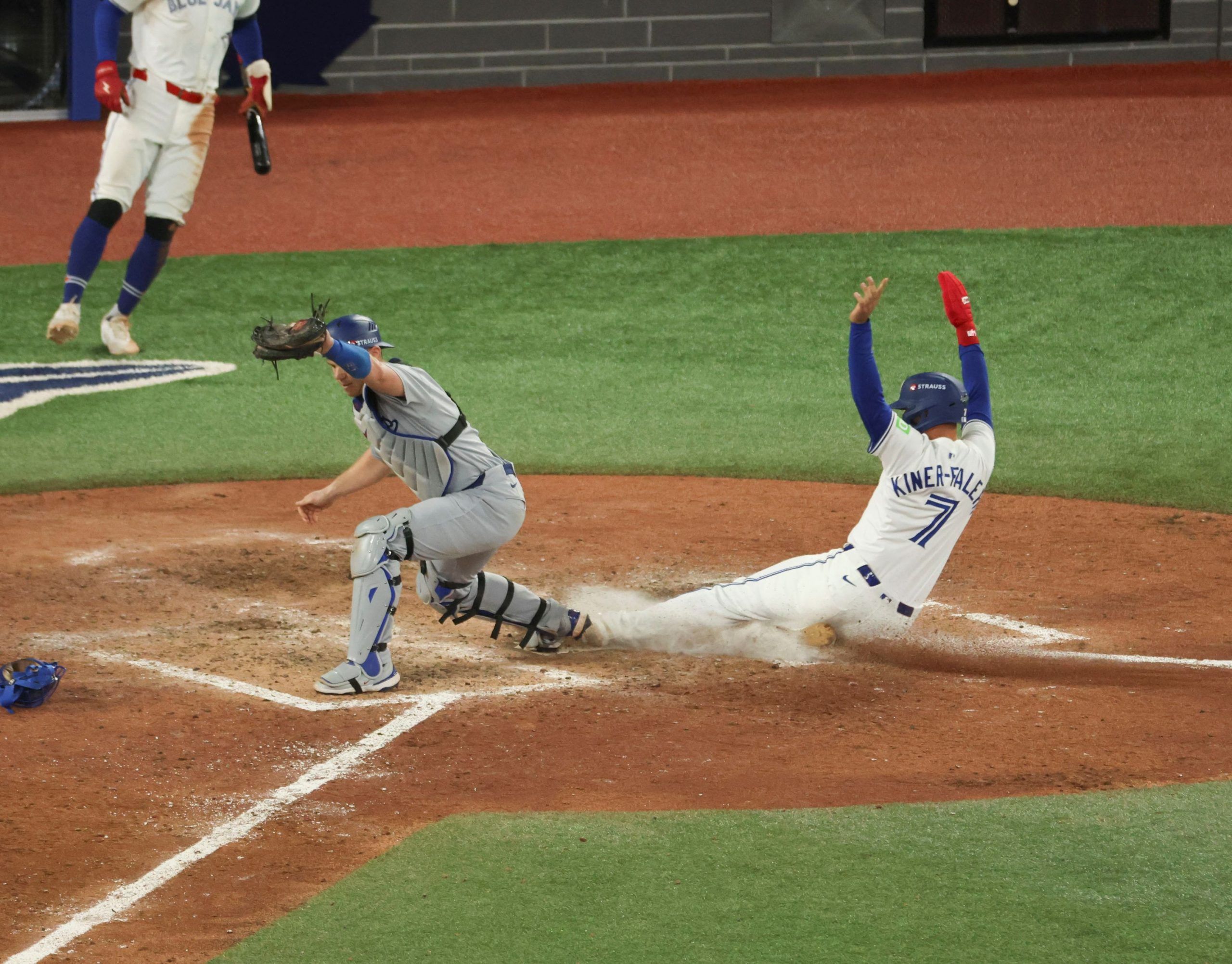  toronto blue jays’ isiah kiner-falefa is forced out at home plater in the ninth inning by los angeles dodgers catcher will smith in game 7 on on saturday night.