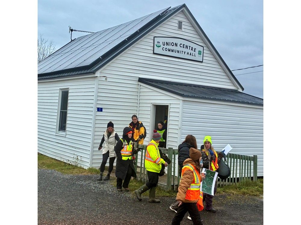 Volunteers leave Union Centre Community Hall before driving 15 kilometres down Highway 289 to begin their search for Lilly and Jack Sullivan on Saturday morning.