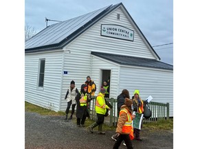 Volunteers leave Union Centre Community Hall before driving 15 kilometres down Highway 289 to begin their search for Lilly and Jack Sullivan on Saturday morning.