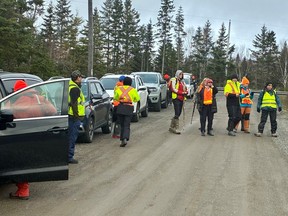 Volunteers begin their search from Lansdowne Station Road on Saturday morning.