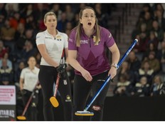 Christina Black shouts to her sweepers as Emma Miskew looks on during Game 2 of the best-of-three Olympic curling trial final in Halifax on Saturday.