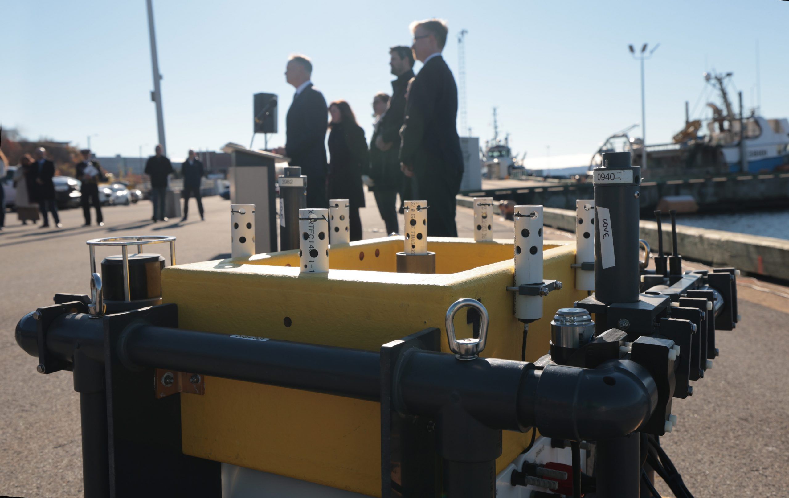  david j. mcguinty, minister of national defence, speaks at an announcement at the centre for ocean ventures and entrepreneurship (cove) in dartmouth on friday. in the foreground is a dusn (distributed underwater sensor network) developed by dartmouth-based omnitech. one of its uses is for detecting underwater acoustics.