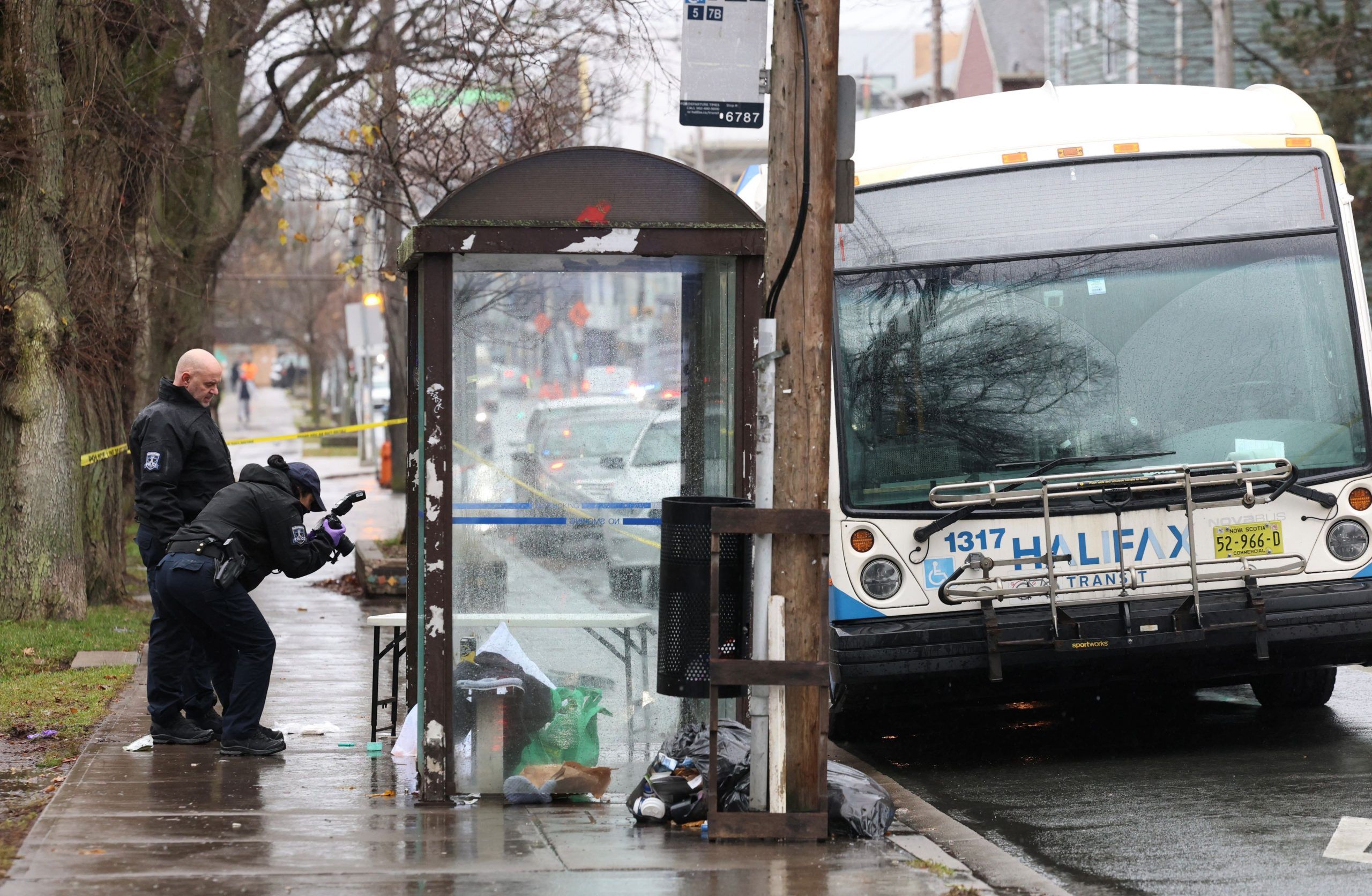 members of the halifax regional police forensic investigative unit process the scene following an incident on gottingen street in halifax on wednesday,