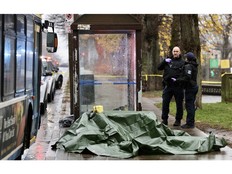 Members of the Halifax Regional Police forensic investigative unit process the scene of an incident on Gottingen Street in Halifax on Wednesday.