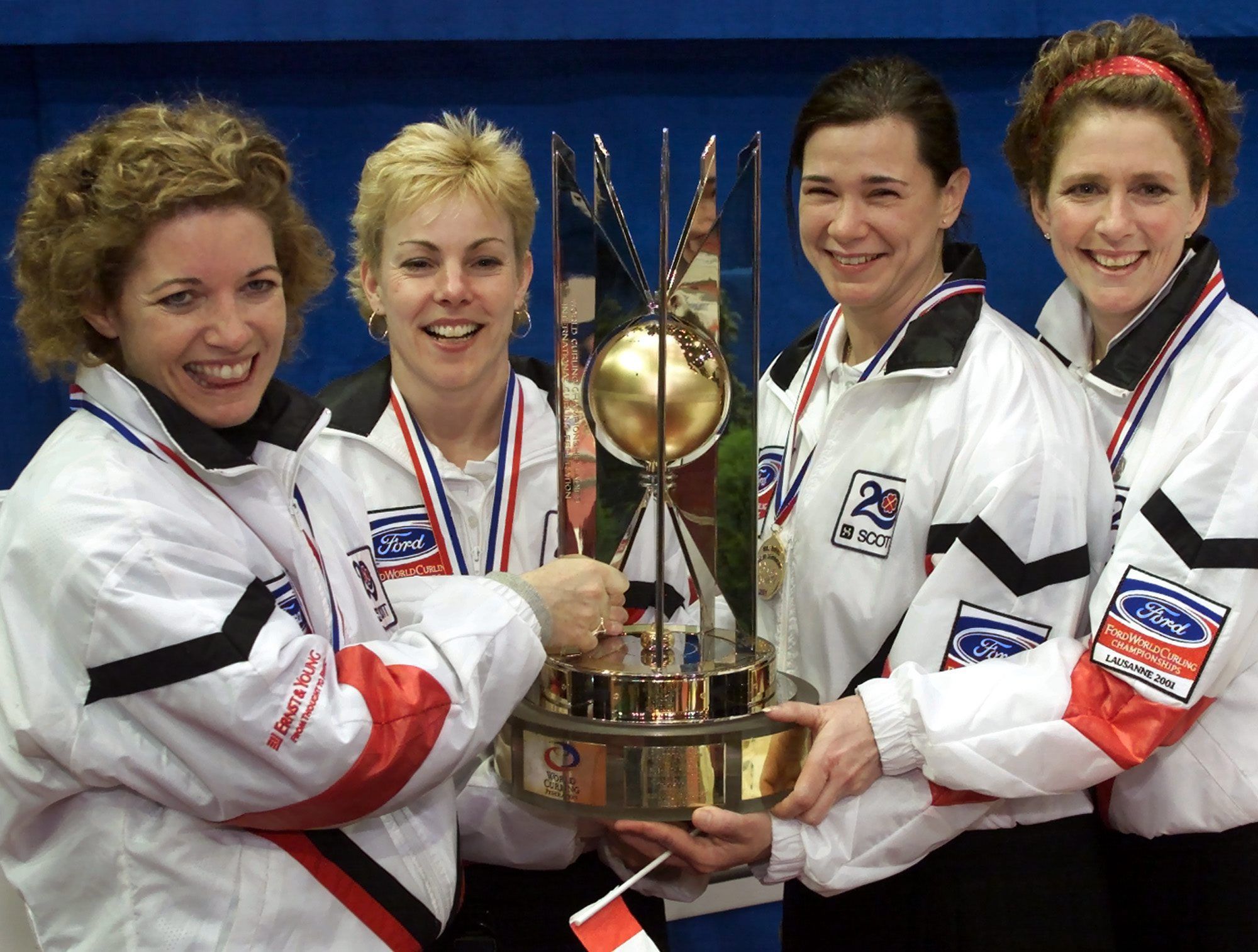  team canada skip colleen jones, kim kelly, mary-anne waye and nancy delahunt (left to right) clutch the trophy after winning the world curling championships in lausanne, switzerland on april 7, 2001 by defeating sweden 5-2.