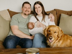 Shaugn, left, and Emily Best pose for a family photo with 11-month-old son James and Golden Retriever Sadie at their Kingston, P.E.I. home.