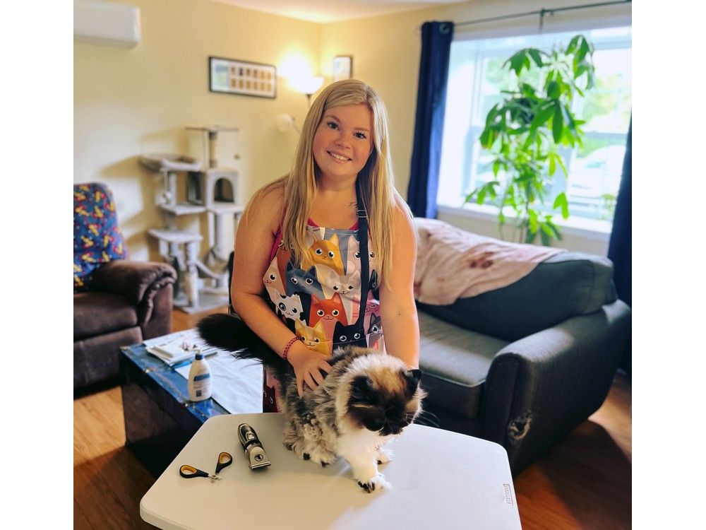 Sabrina Burroughs is the owner of Sabrina's Mobile Cat Grooming. She offers her service throughout the South Shore and focuses not only on the actual grooming but making the experience positive for both owner and cat. With Burroughs is feline friend Bella. STEVEN FLOWERS AND NIKITA HILL