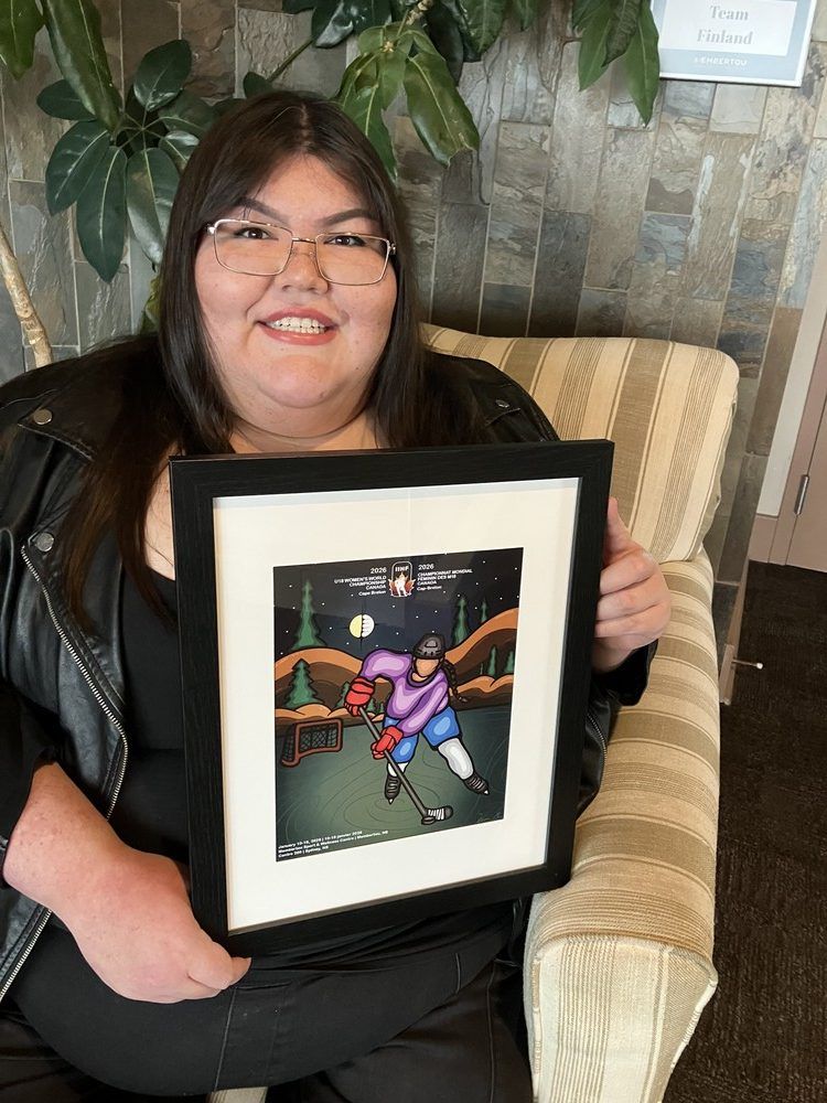 Flag and poster represent Membertou, women and hockey