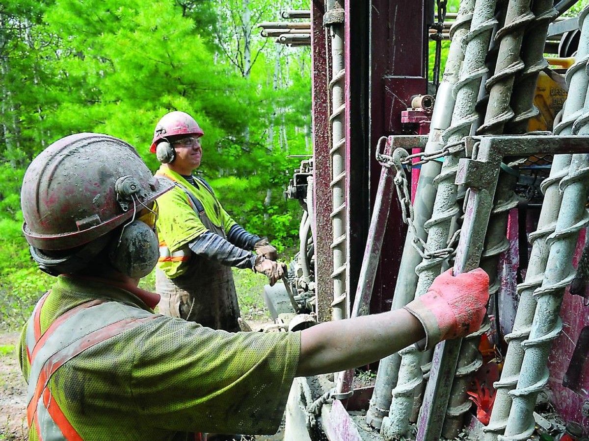 Driller's helper Mark Waite, left, and driller Brody Harding are shown in a file photo, as they prepare to work at a fracking site in New Brunswick.