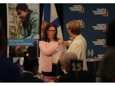 Michelle Thompson, Minister of Health and Wellness, and Karen Oldfield, NS Health CEO fist bump prior to the Future of Healthcare in Nova Scotia event hosted by the Halifax Chamber of Commerce in Halifax Thursday May 14, 2026.