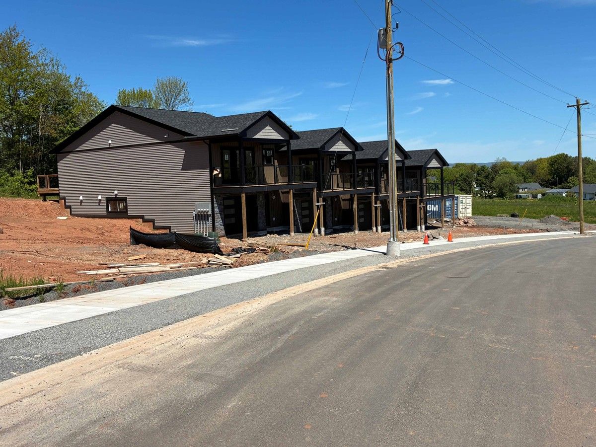  these townhouses are among the first buildings going up in a new development off maple avenue in wolfville.