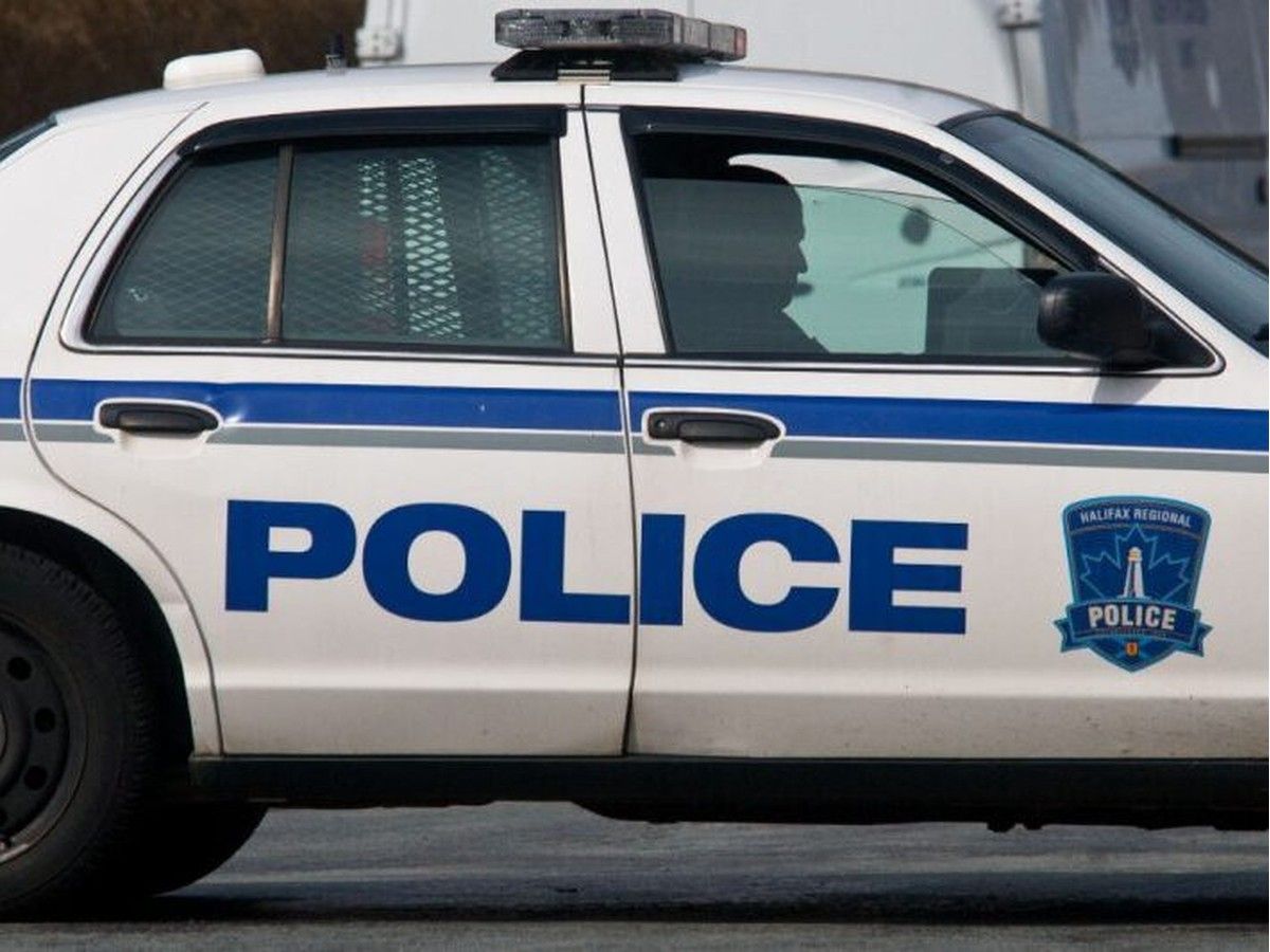 A Halifax Regional Police officer sits in a cruiser. - POSTMEDIA FILE